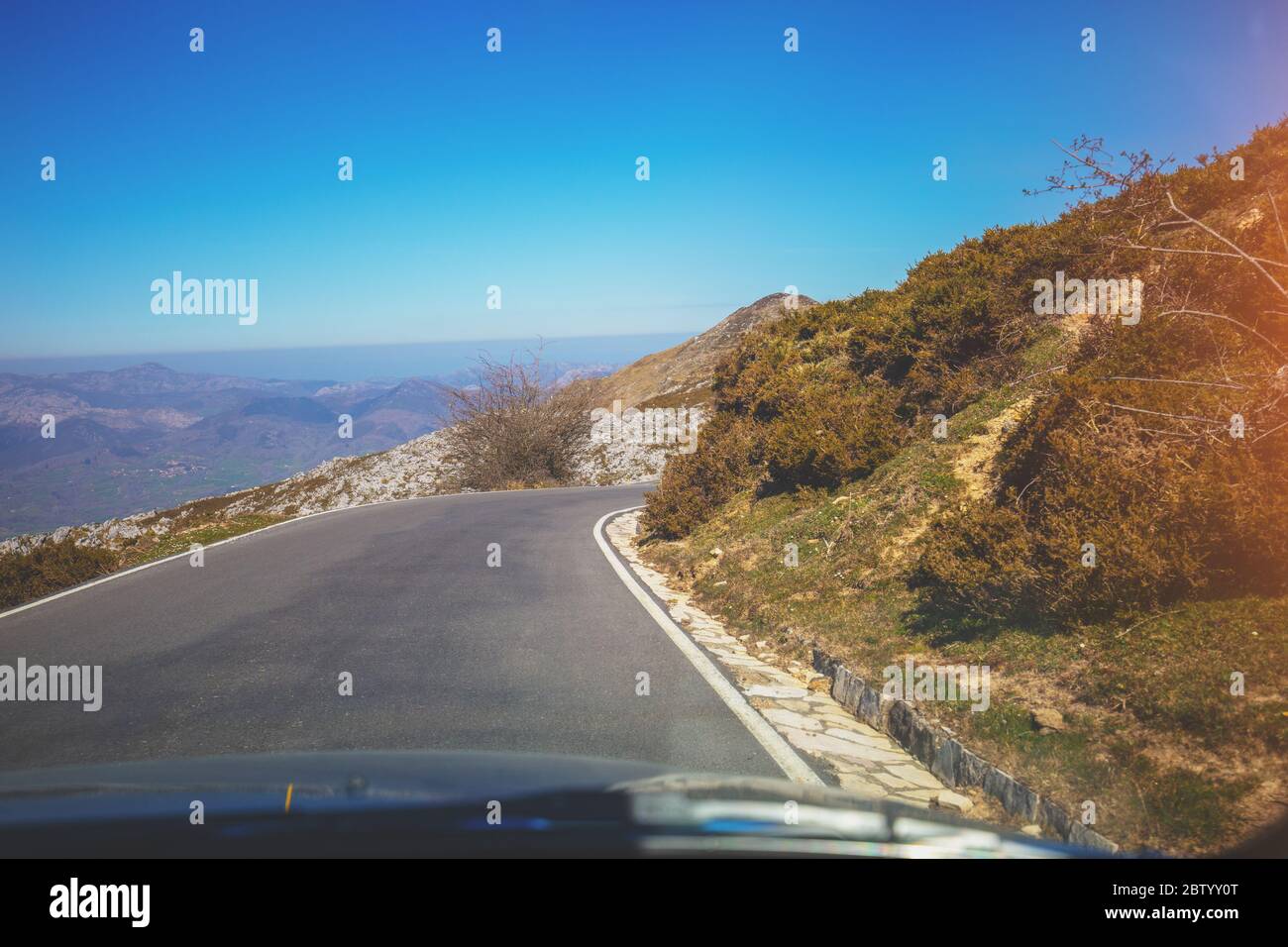 View of beautiful mountain landscape through the windscreen on a sunny ...