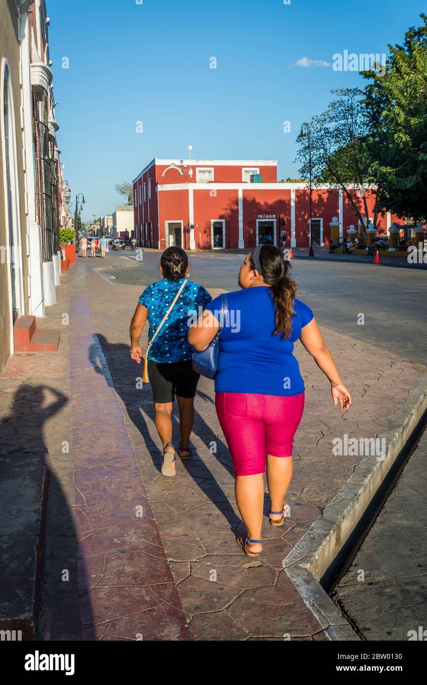 Mayan women walking at he main square, Valladolid, Yucatan, Mexico Stock Photo