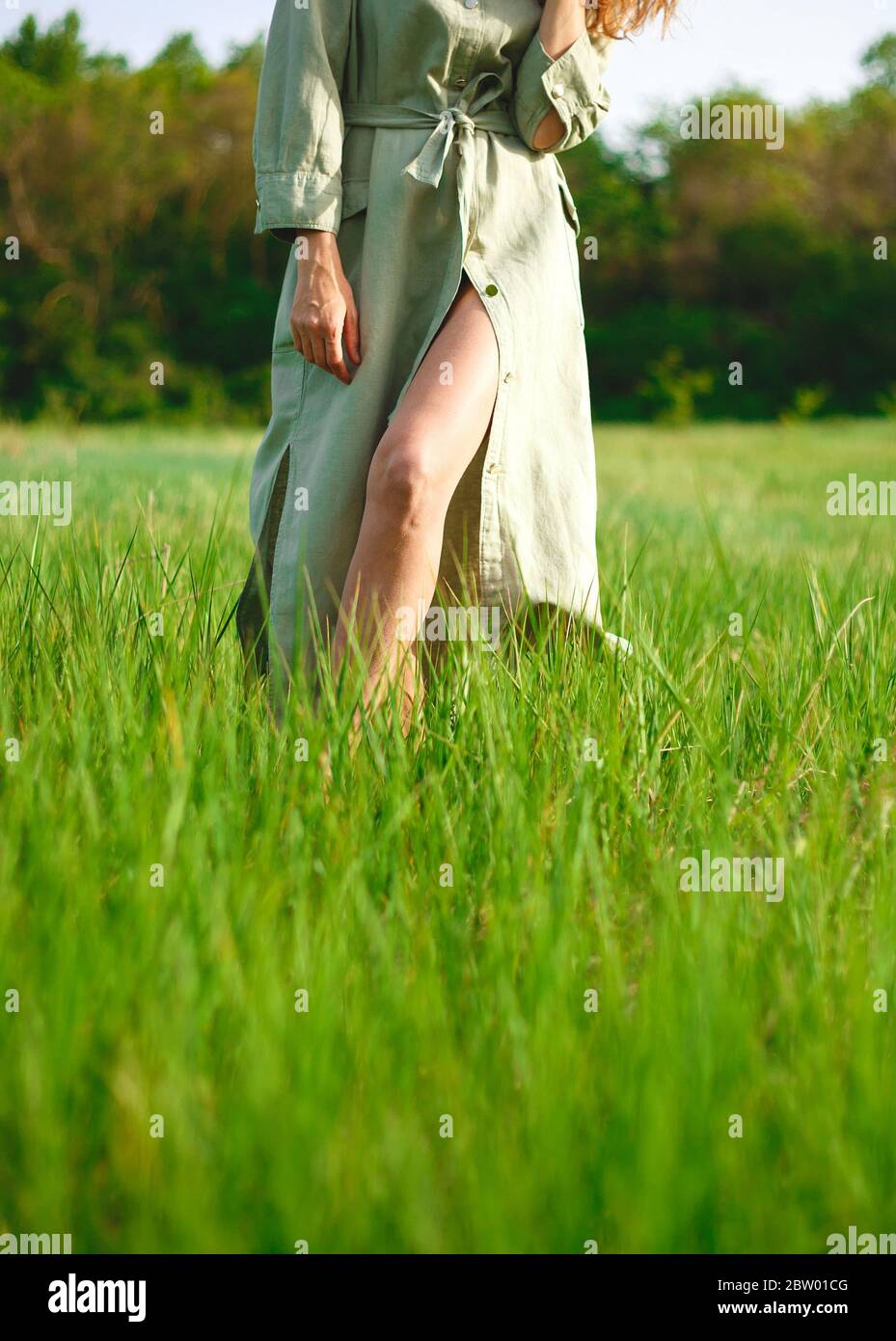 One woman walk barefoot grass hi-res stock photography and images - Alamy