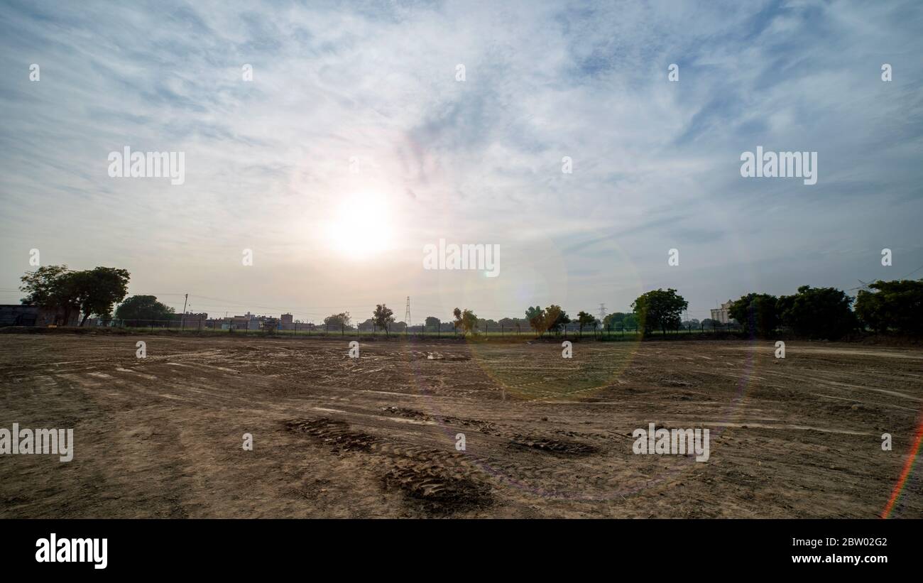 Agriculture field trees and dramatic cloudy sky Stock Photo - Alamy