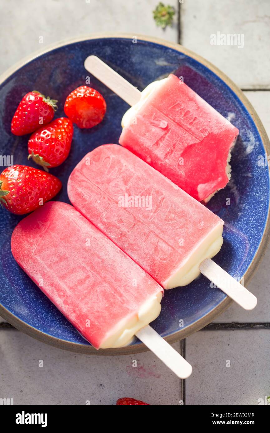 Strawberry and cream summer popsicles Stock Photo