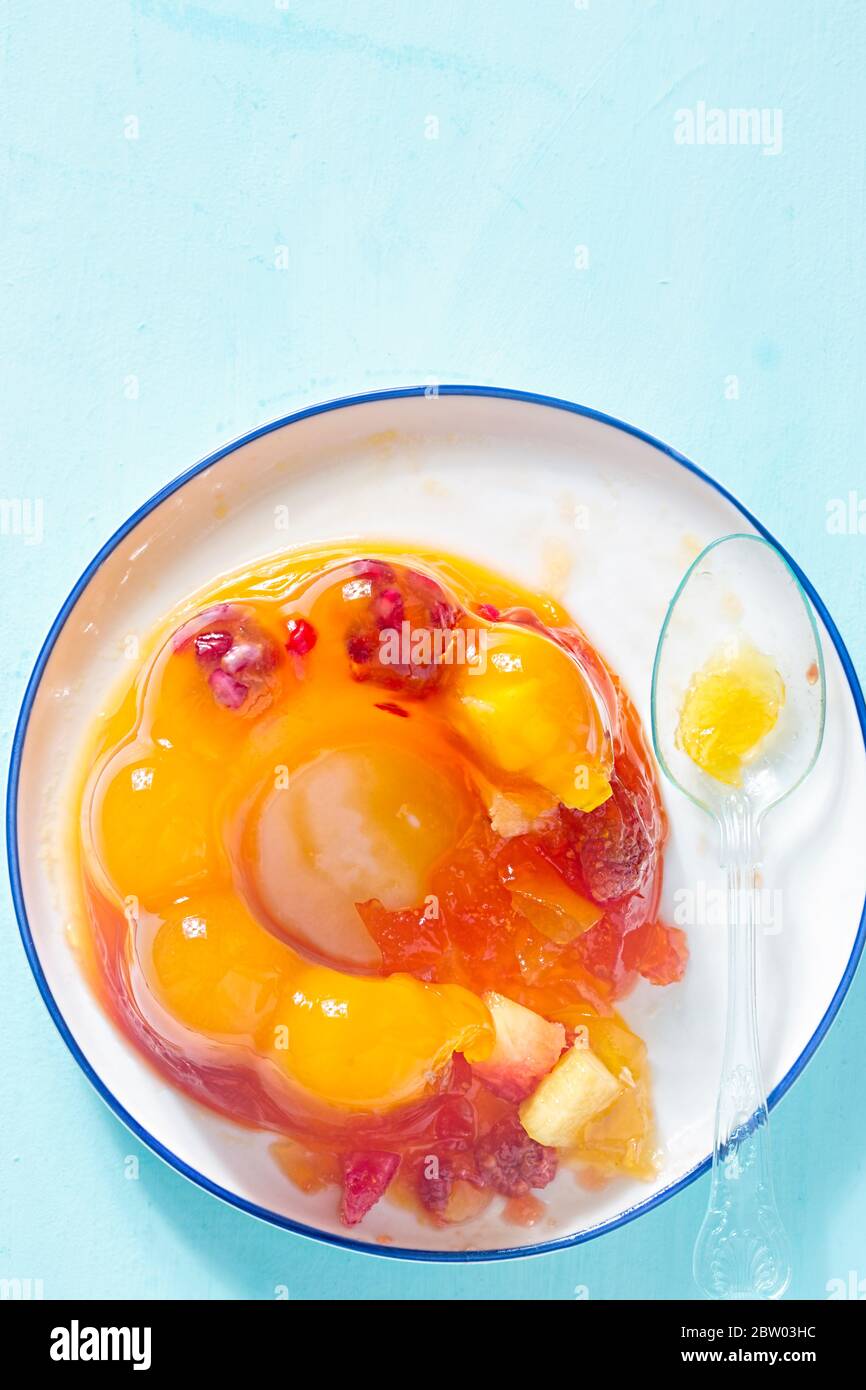 Pineapple raspberry fruit jelly with spoon Stock Photo - Alamy