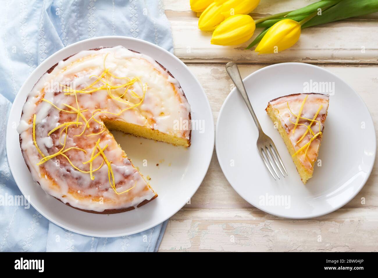 Lemon drizzle cake with icing Stock Photo - Alamy