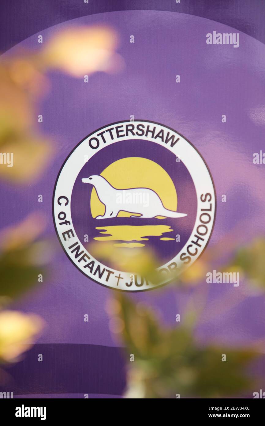 School sign in the village of Ottershaw, Runnymede, Surrey, England, UK Stock Photo