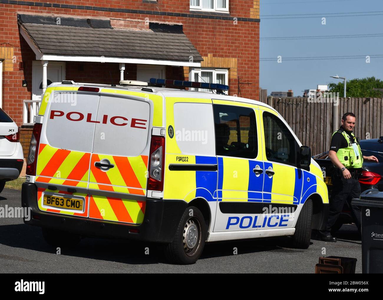Police activity in Mansion Drive, Tipton, West Midlands, where a man has been arrested by armed police after a baby and a woman suffered serious injuries. Stock Photo