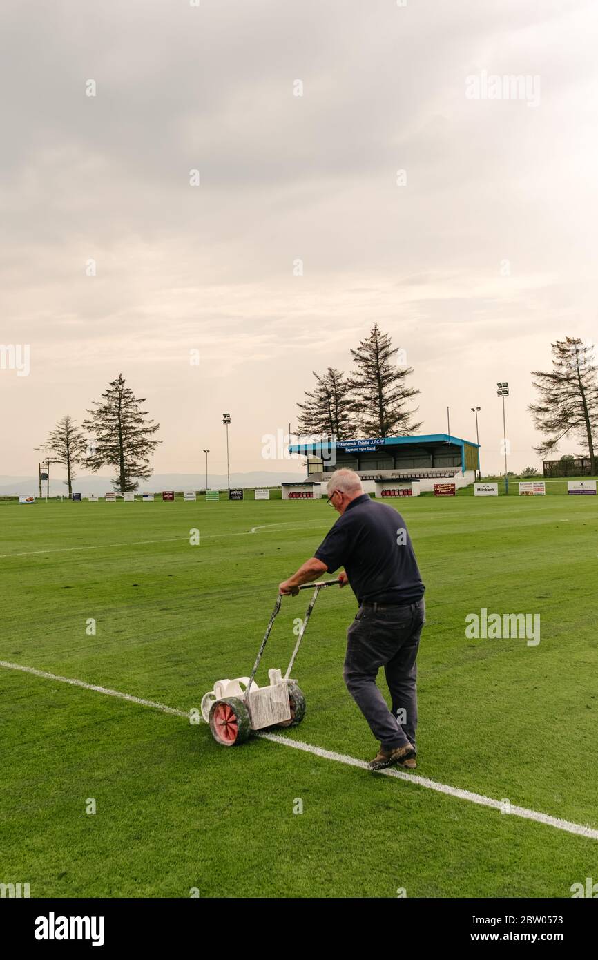 Groundsman at Kirriemuir Thistle Football Club football pitch painting