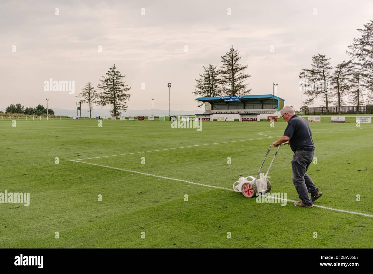 Groundsman at Kirriemuir Thistle Football Club football pitch painting