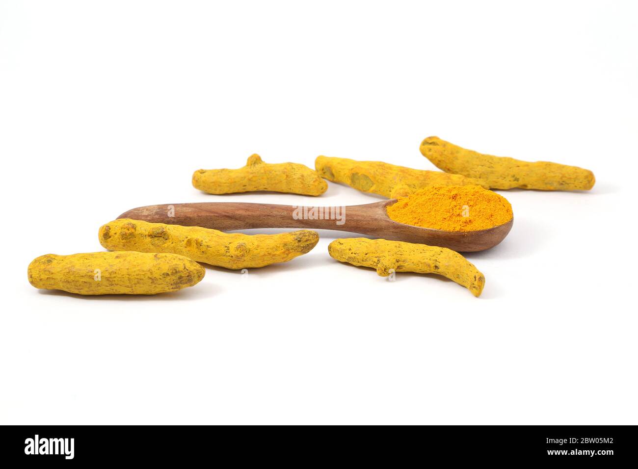Turmeric powder and roots Stock Photo