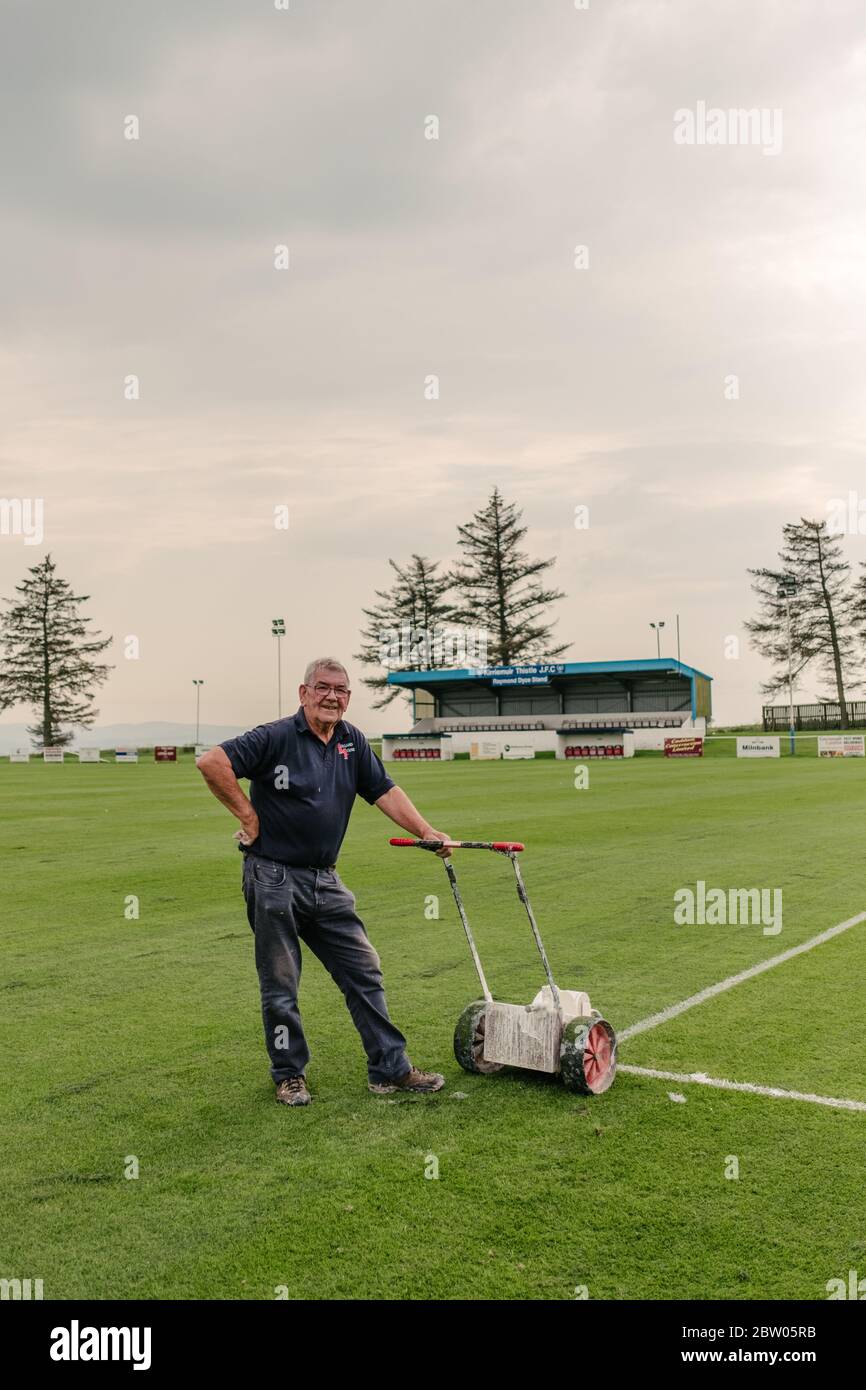 Groundsman at Kirriemuir Thistle Football Club football pitch painting