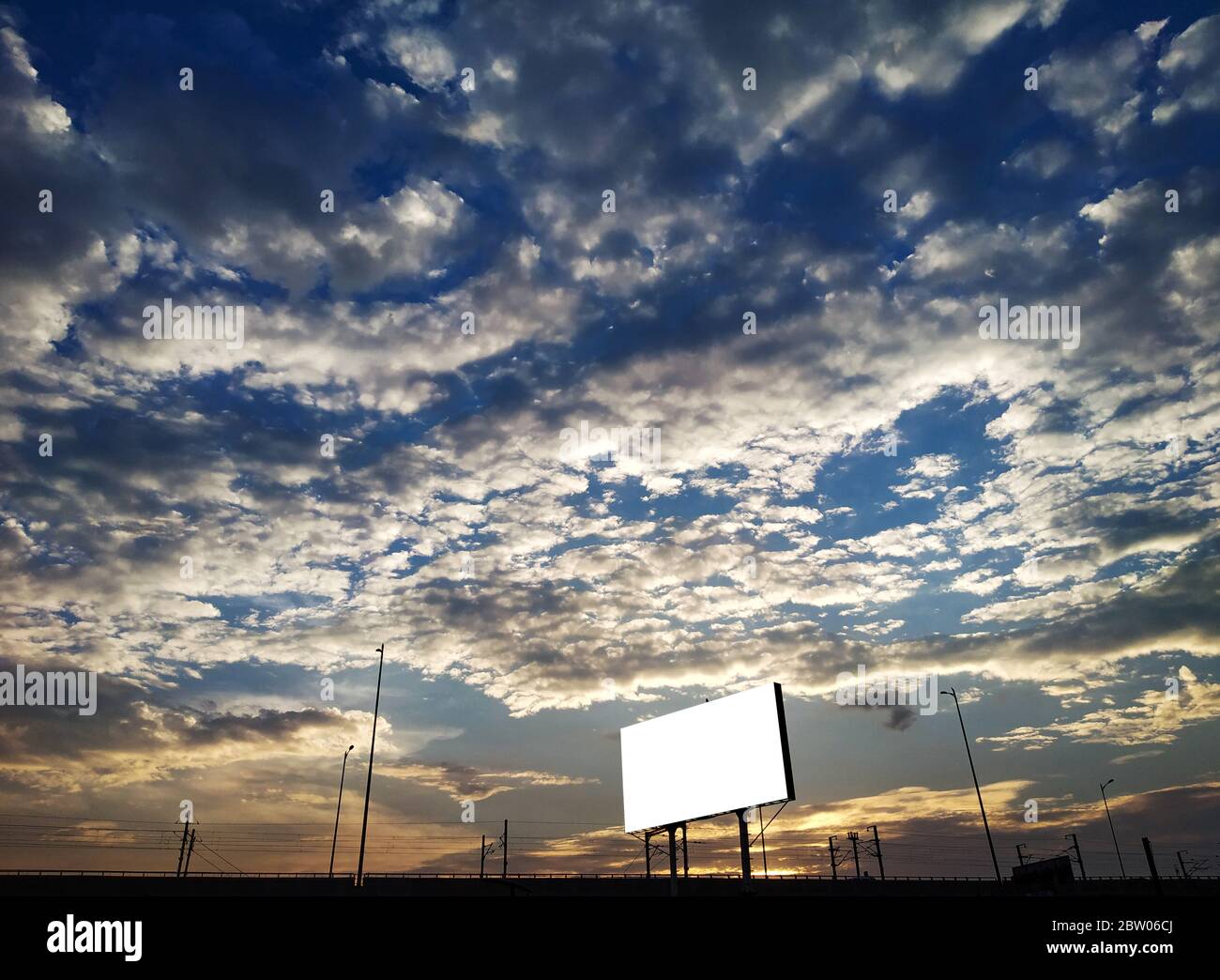Dramatic cloudy sky natural background and advertising billboard Stock Photo