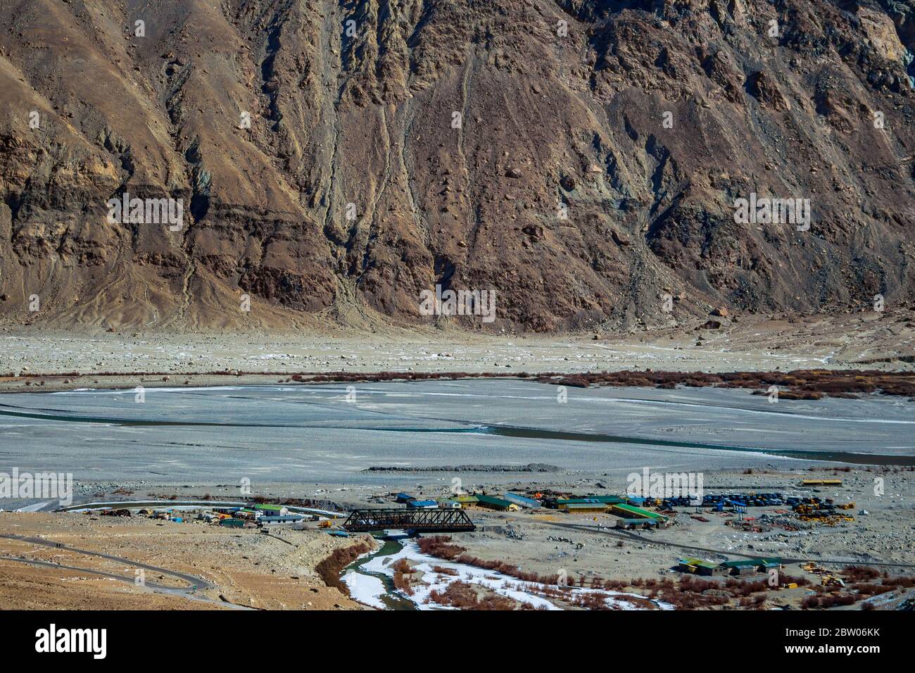 An iron cladded bridge connecting National Highways roads in Ladakh, Jammu and Kashmir, India, Asia. Snow mountains in Ladakh is amazing. Landscape. Stock Photo