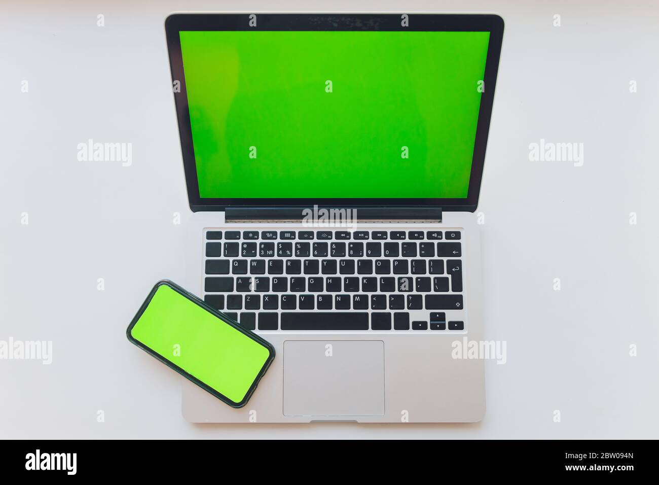 watch by use multiple internet electronic devices with green screen Stock Photo