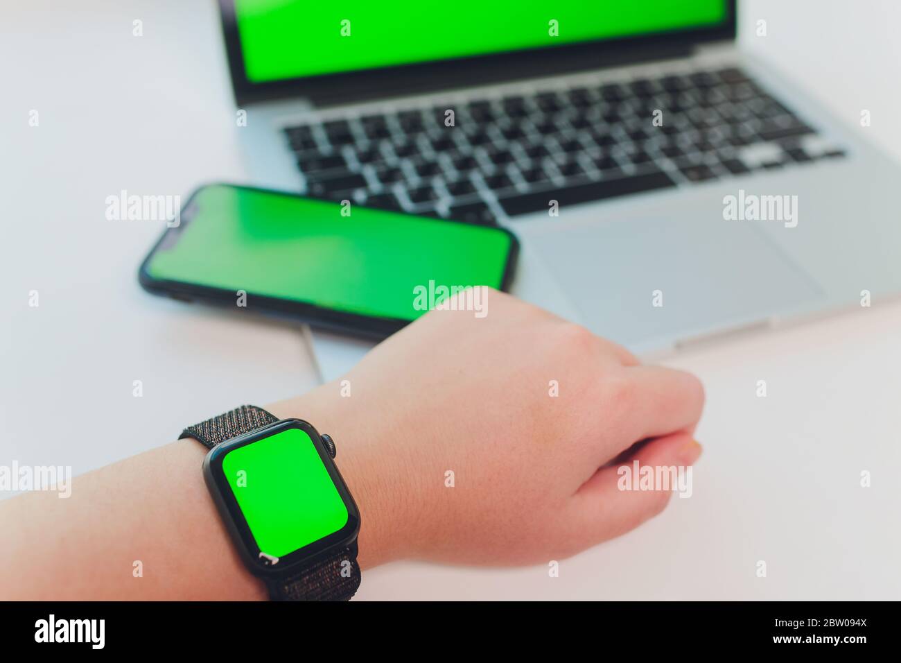 watch by use multiple internet electronic devices with green screen Stock Photo