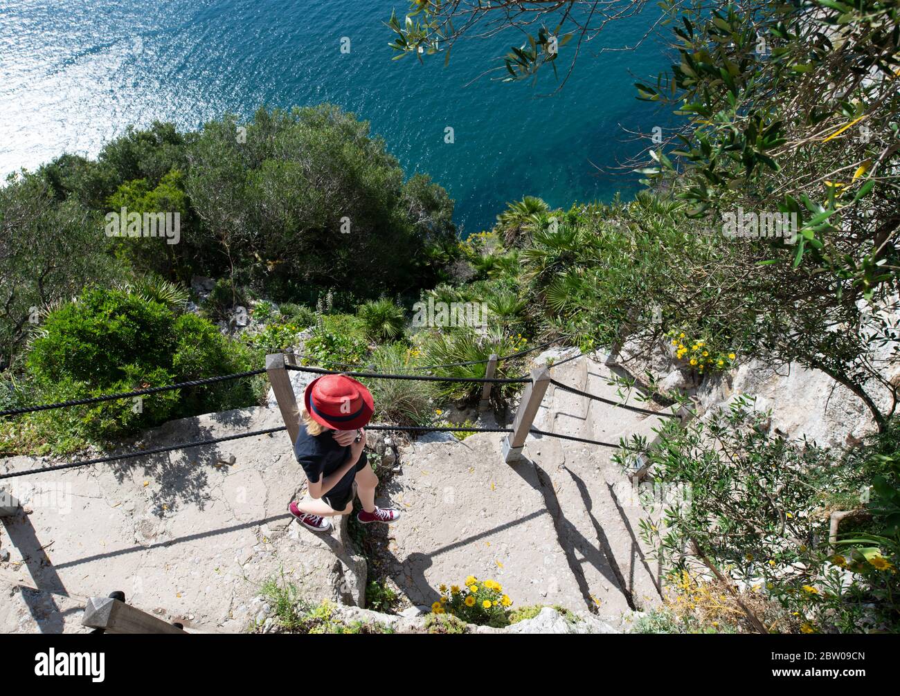 Teenage girl walking along the Mediterranean steps footpath in Gibraltar  Stock Photo - Alamy