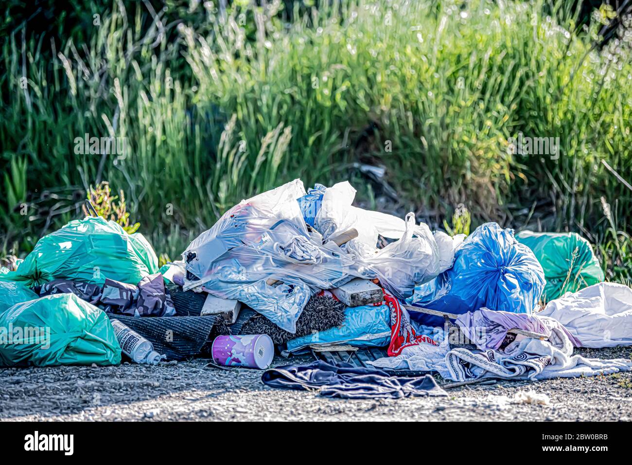 Illegal Fly tipping rubbish dumped in country side May 2020 Stock Photo