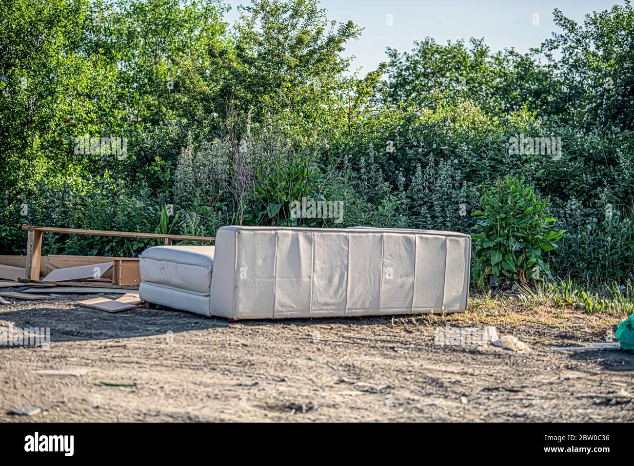 Illegal Fly tipping rubbish dumped in country side May 2020 Stock Photo