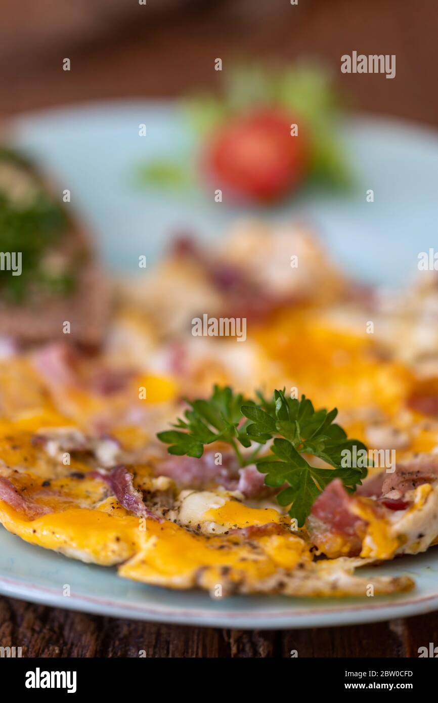 scrambled eggs on a blue plate Stock Photo
