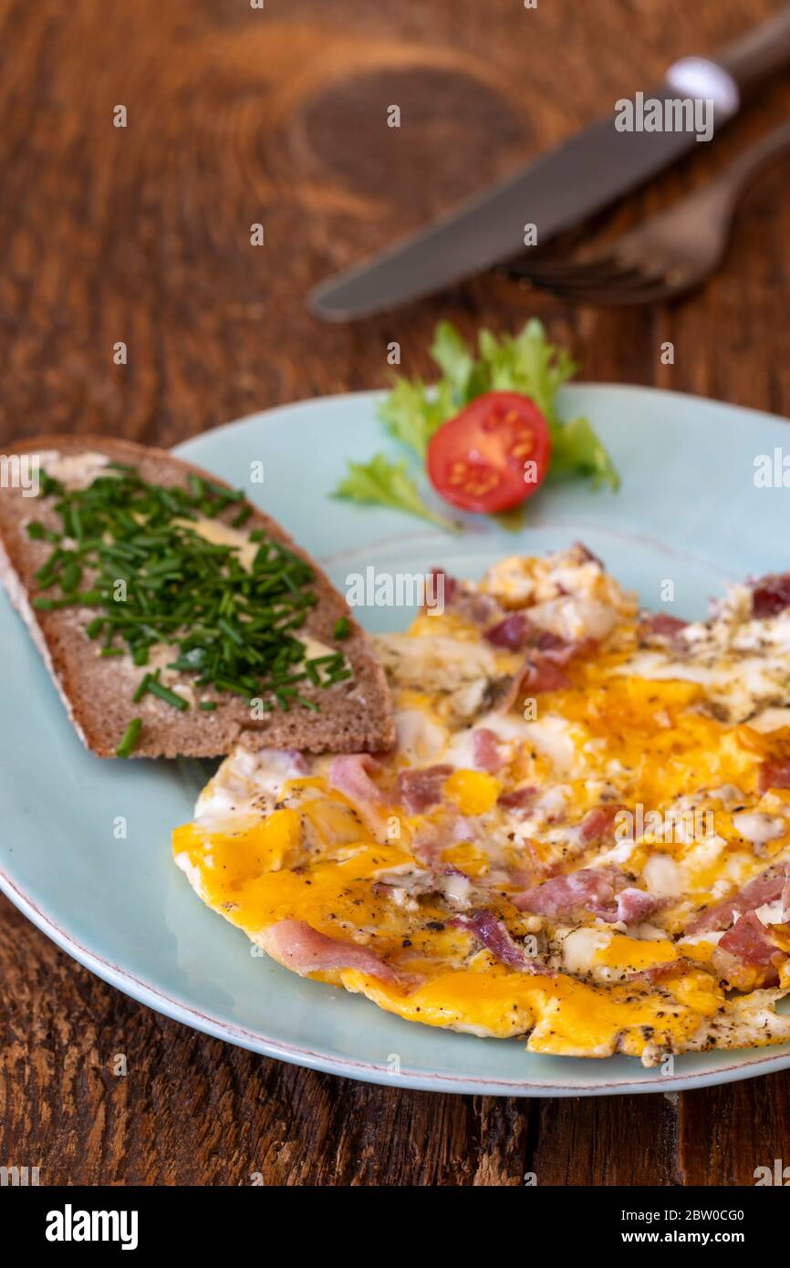 scrambled eggs on a blue plate Stock Photo