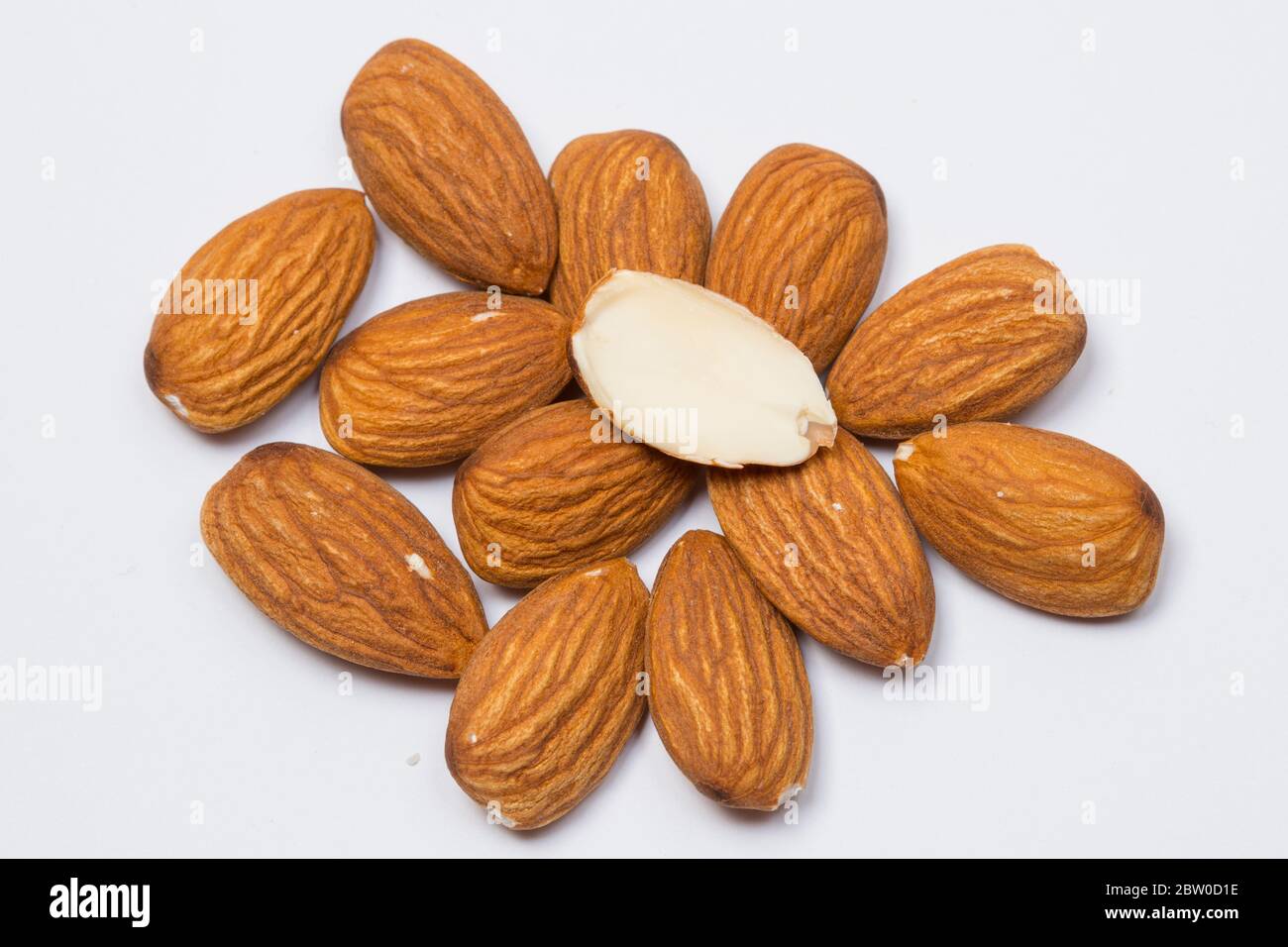 Close-up view of almonds on white background. Stock Photo