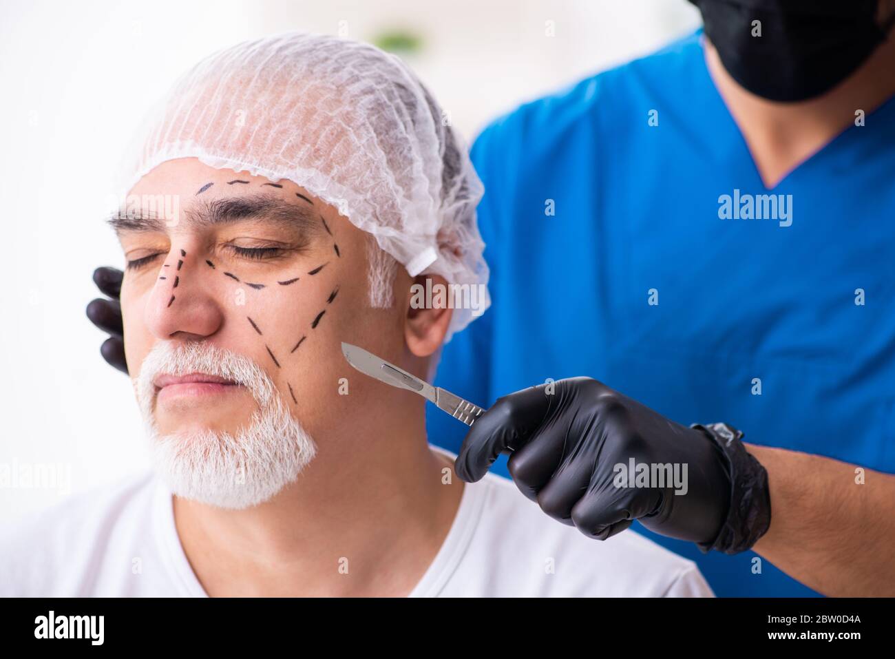 Old man visiting doctor for plastic surgery Stock Photo Alamy
