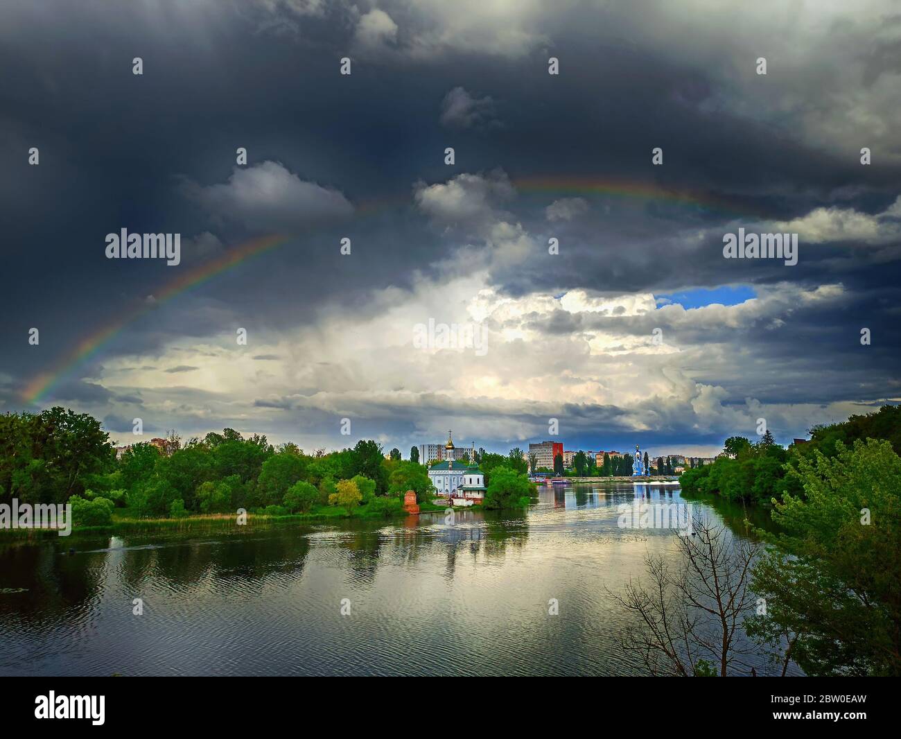 Beautiful view of cityscape in rainy cloudy weather with rainbow. Church of Blessed Xenia of St. Petersburg (centre) , Vinnytsia, Ukraine Stock Photo