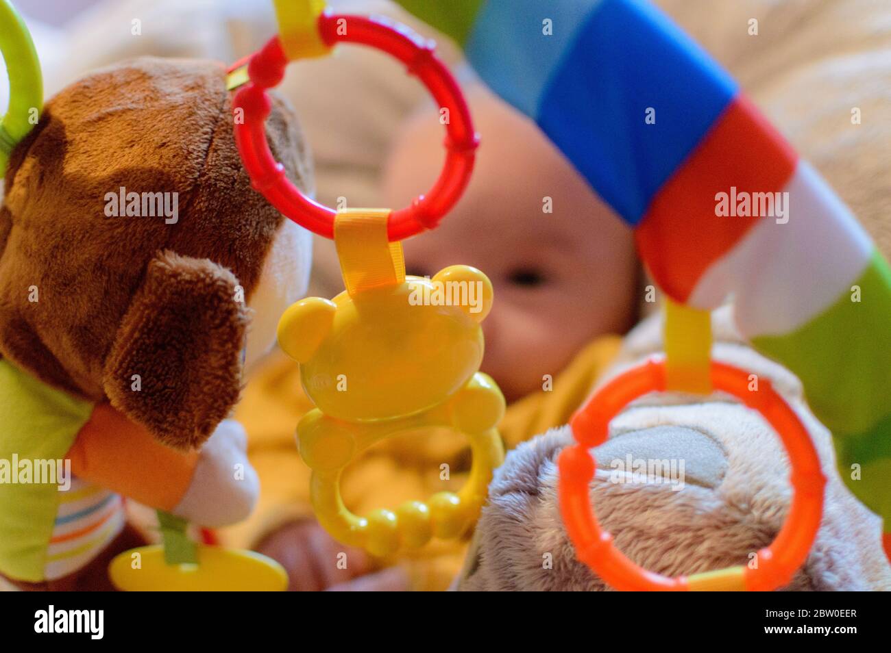 Blurred Baby Actively Playing In Her Rainbow Playground. Stock Photo
