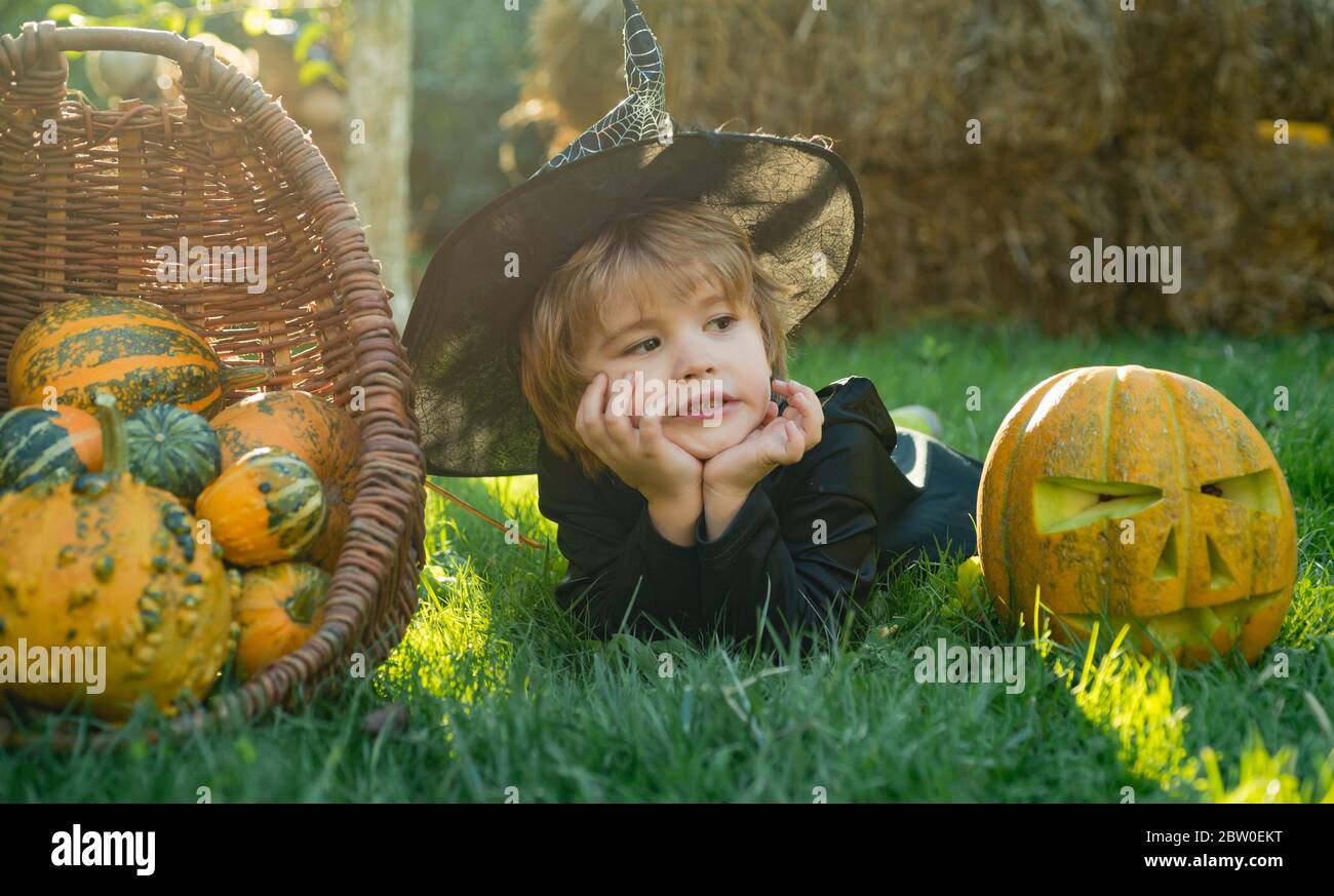 Portrait of Halloween child boy on nature background. Little child have