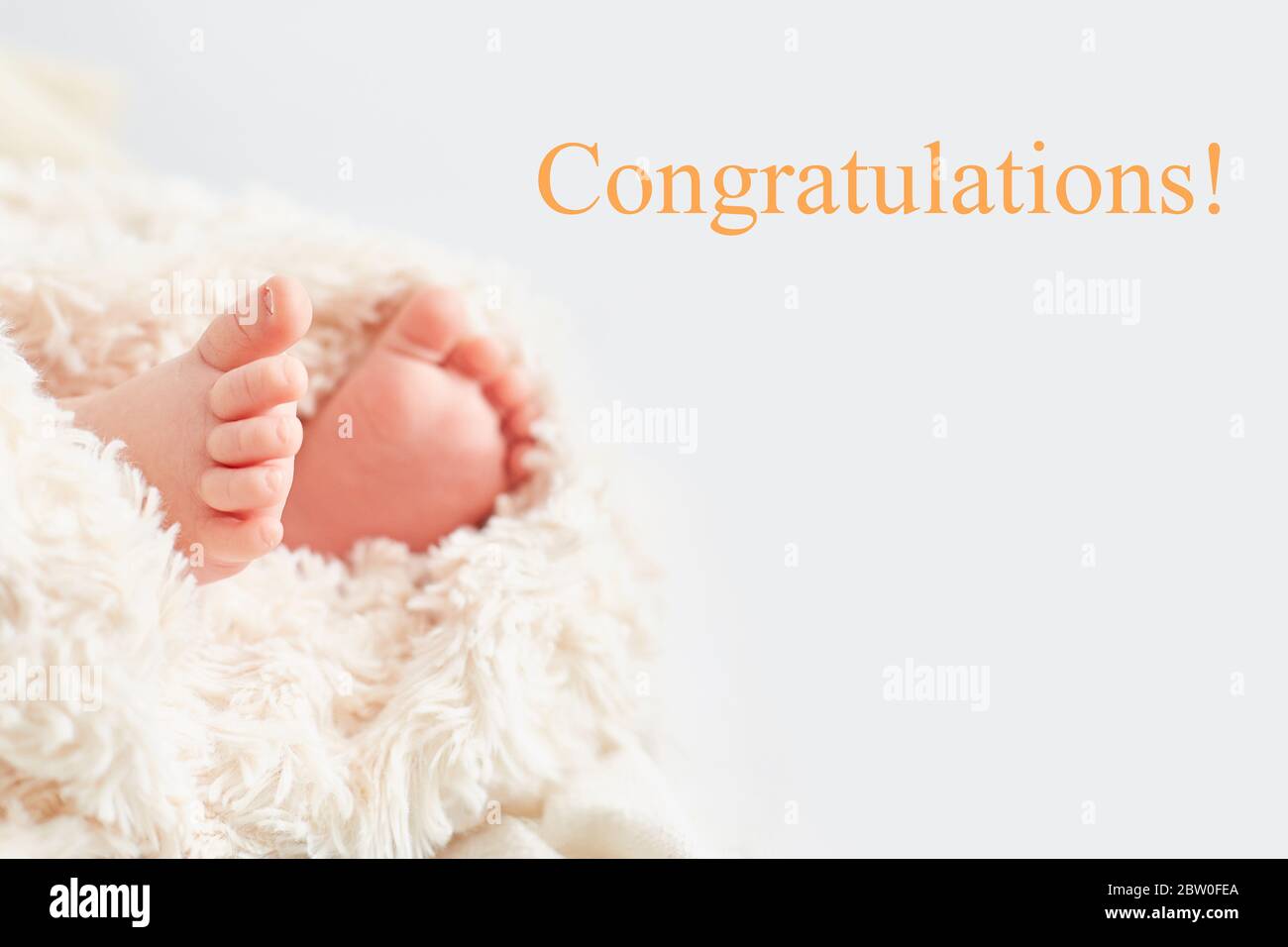 Close-up legs of the child and the inscription "Congratulations Stock Photo  - Alamy