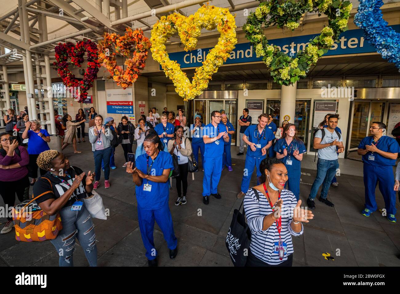London, UK. 28th May, 2020. Hospital staff come out of Chelsea and Westminster and are greeted by a small but enthusiastic crowd, as this was probably the last time - Clap for carers, to say thanks to NHS and other key workers and carers. The 'lockdown' continues in London - Coronavirus (Covid 19) outbreak in London. Credit: Guy Bell/Alamy Live News Stock Photo