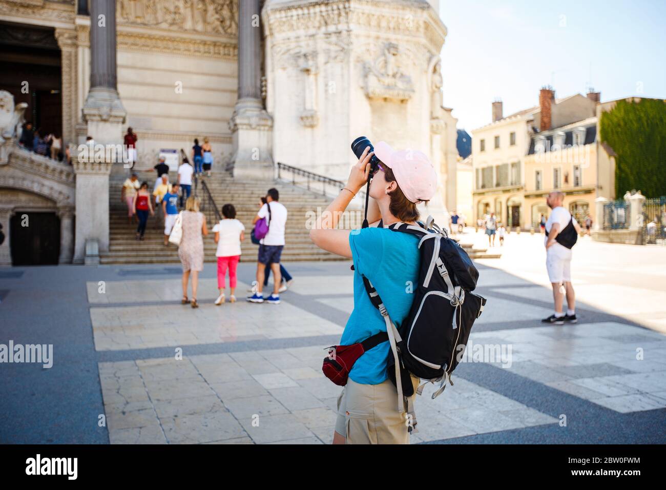 Bergamo Italy girl backpacker standing with backshot photo temple  attractions behind a black backpack Stock Photo - Alamy