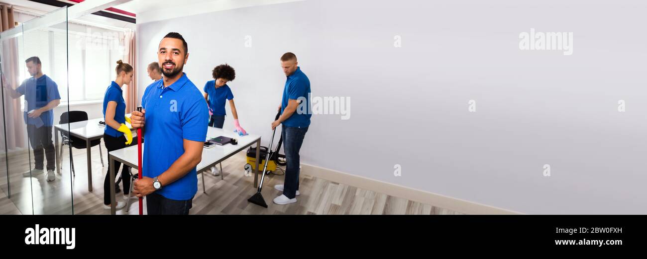 Commercial Office Cleaning Service. Janitor Or Professional Cleaner Stock Photo