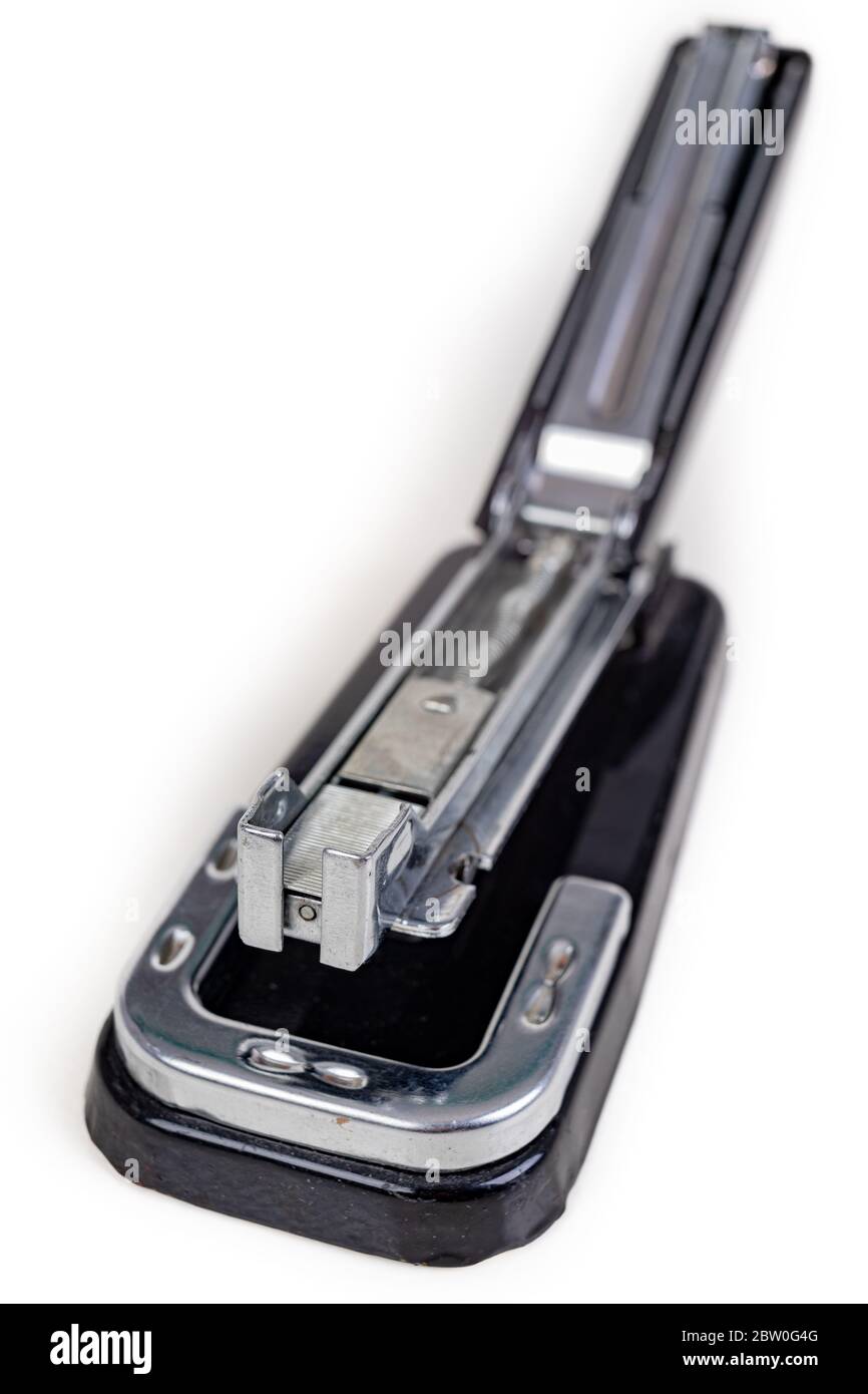 Stapler for fastening sheets of paper. Office accessories for working  behind the desk. Light background Stock Photo - Alamy