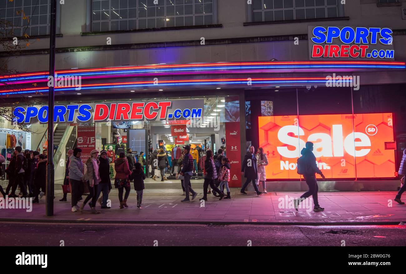 Sports Direct main store on Oxford Street at night with neon lights. London Stock Photo