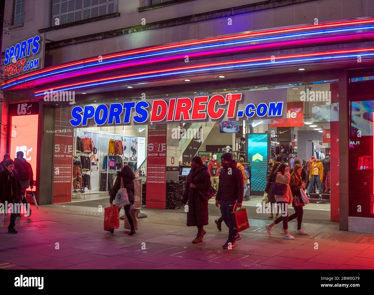 Sports Direct main store on Oxford Street at night with neon lights. London Stock Photo