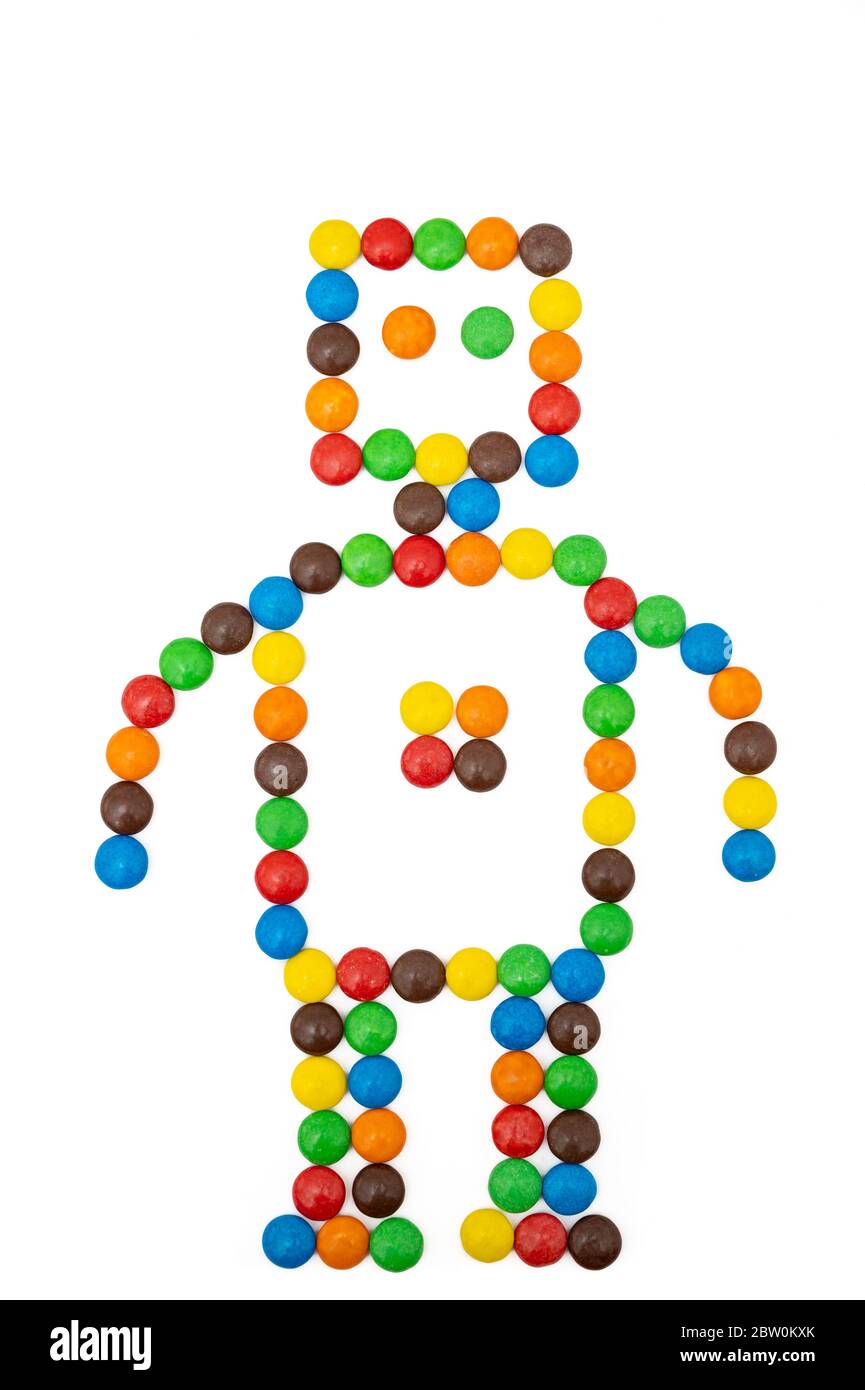 Robot shape made of colorful candies on white background Stock Photo