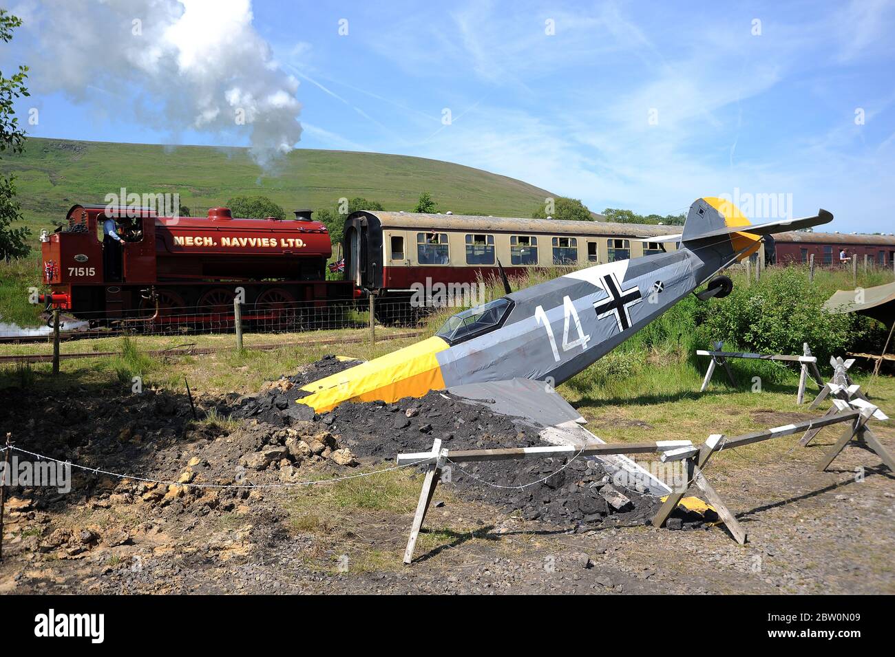 71515 passes the  mock - up of a downed Messerschmidt at Furnace Sidings during a '1940's Weekend' at the Pontypoo and Blaenavon Railway. Stock Photo