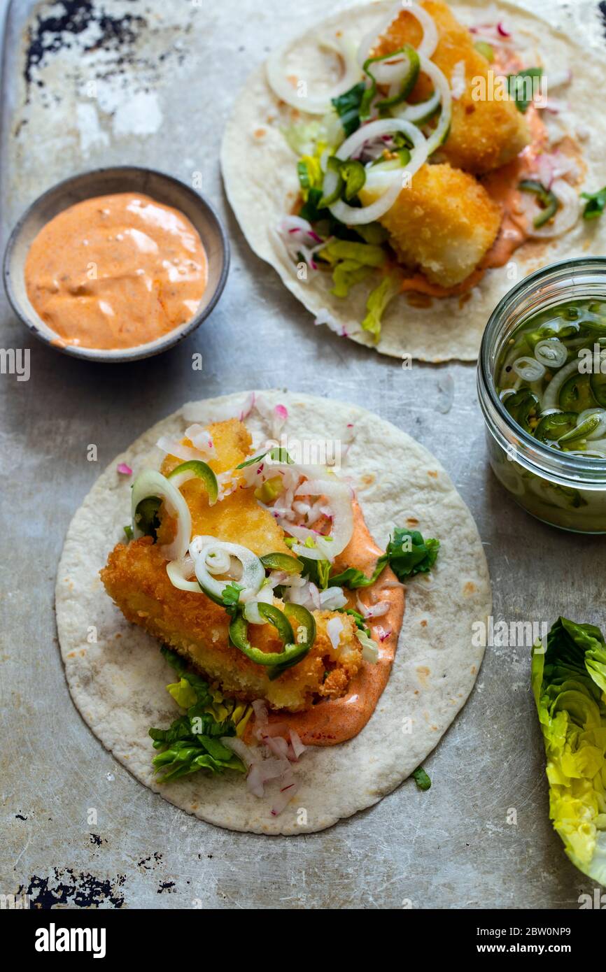 Fish tacos with cod, harrisa sauce, pickled onions and chili Stock