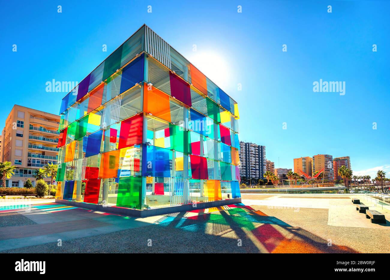 Multicolored glass cube in contemporary art museum Pompidou centre, near new port in Malaga. Spain, Andalusia Stock Photo