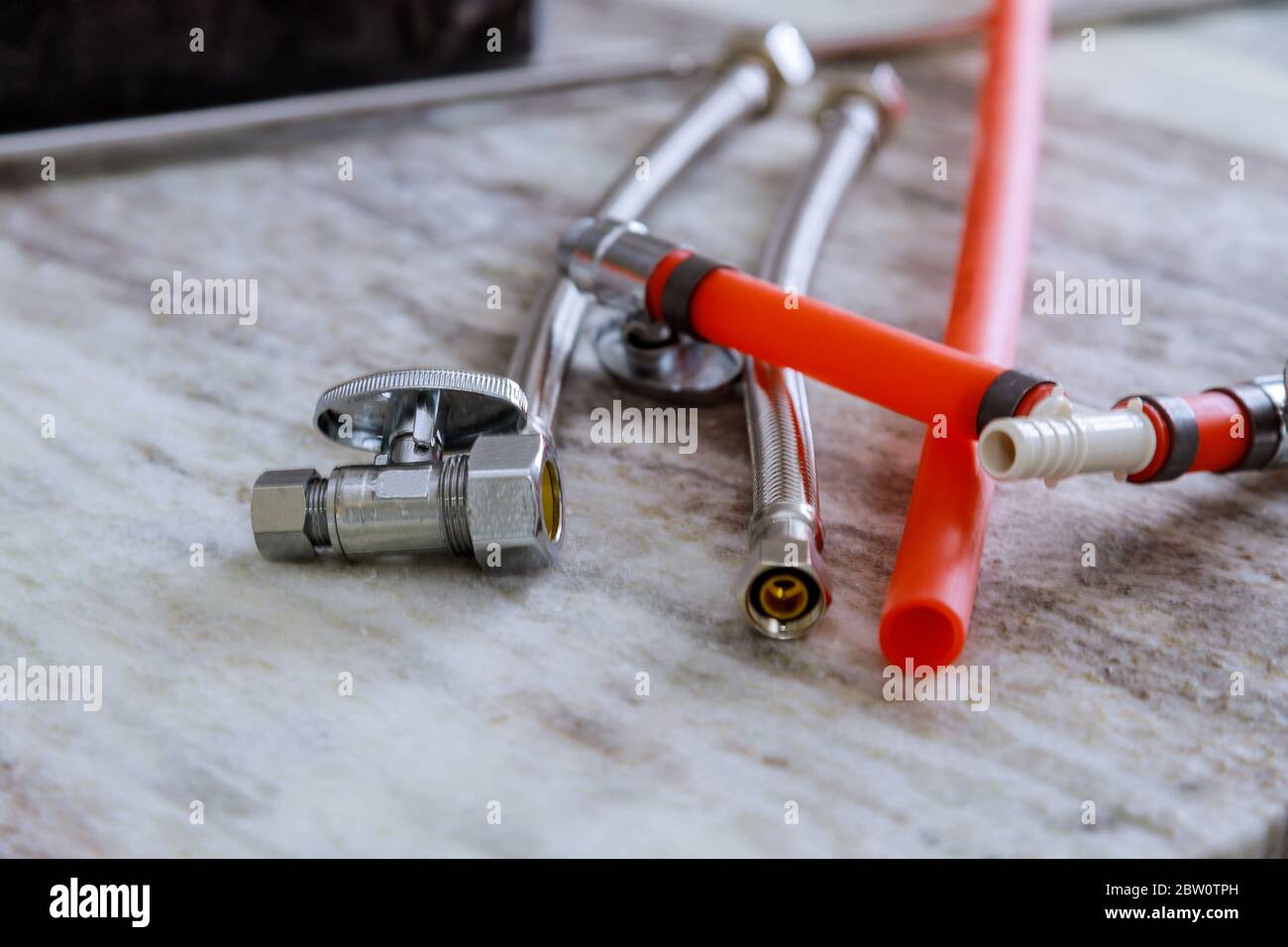 Installation pipe connection new mixer water tap on sink kitchen a new