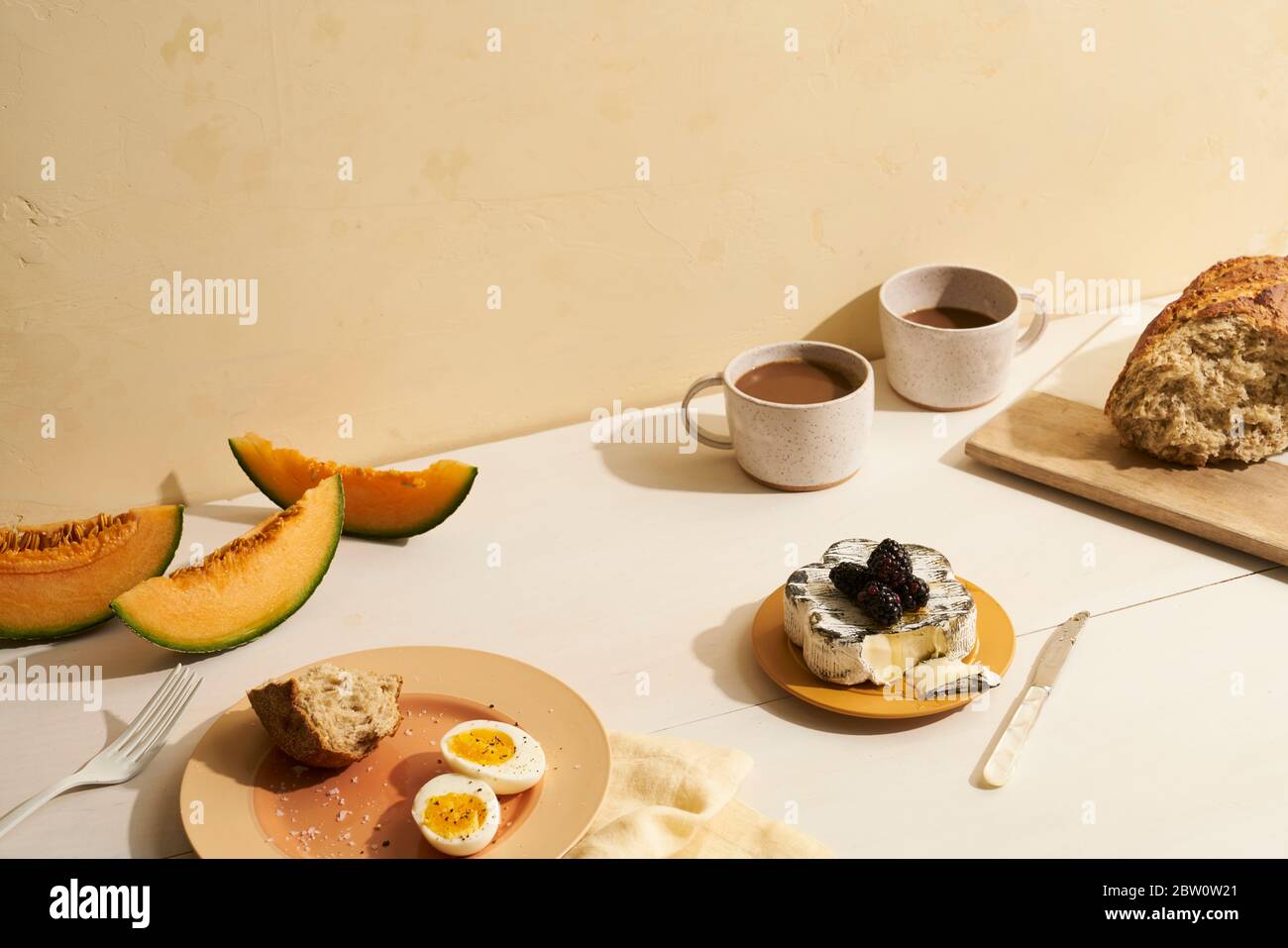 European style brunch or breakfast spread with cheese fruit and bread Stock Photo