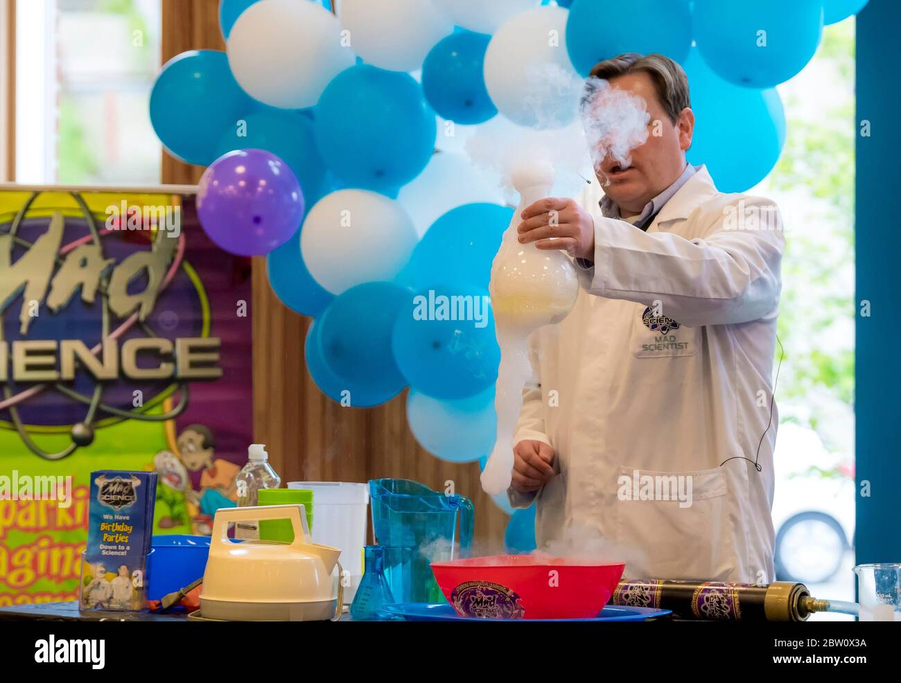 Saint John, New Brunswick, Canada - June 4, 2017: Community day at the port. An educational science demonstration by a man wearing a lab coat. Stock Photo