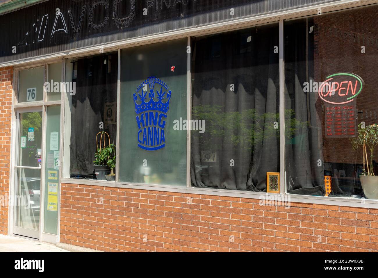 Saint John, NB, Canada - July 20, 2019: King Canna is an unlicensed cannabis dispensary. There is a neon 'OPEN' sign in the window. Unlicensed cannabi Stock Photo