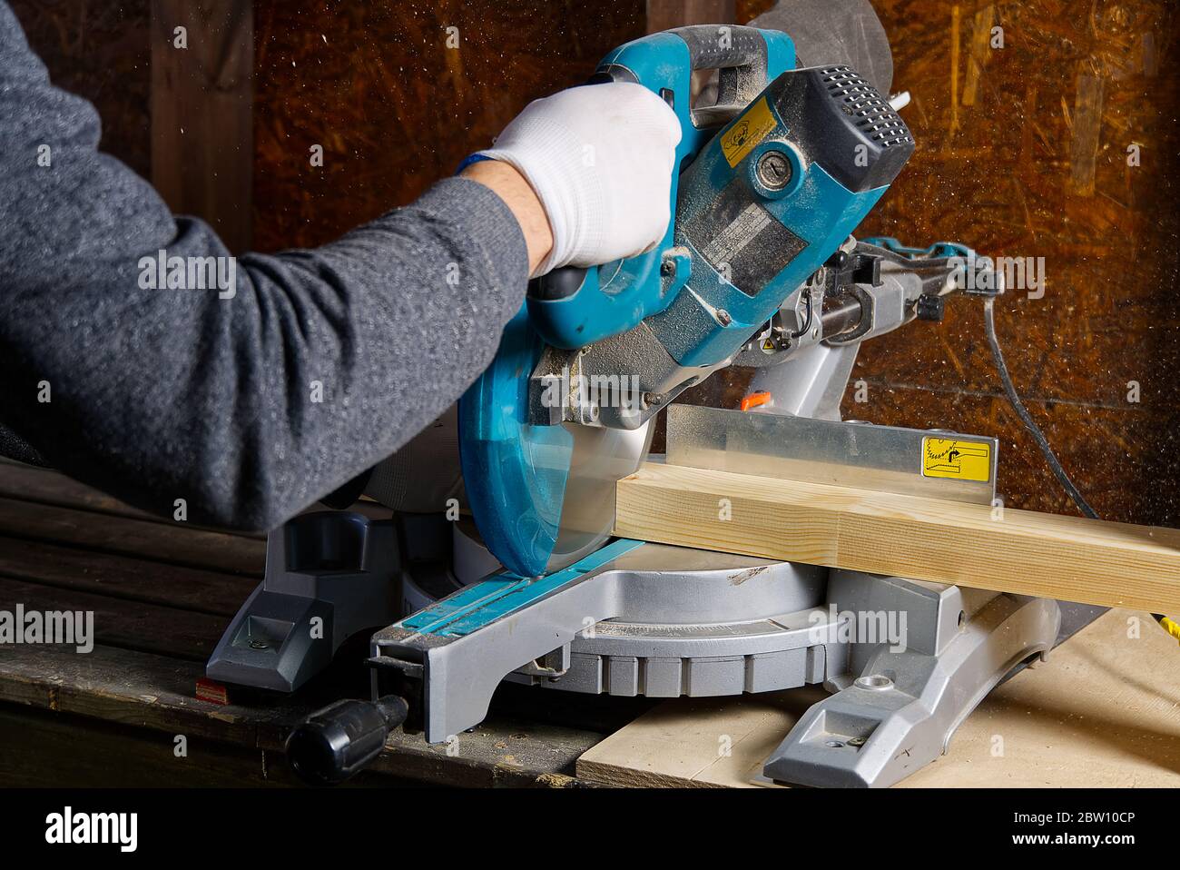 Closeup of professional makers working with electric circular