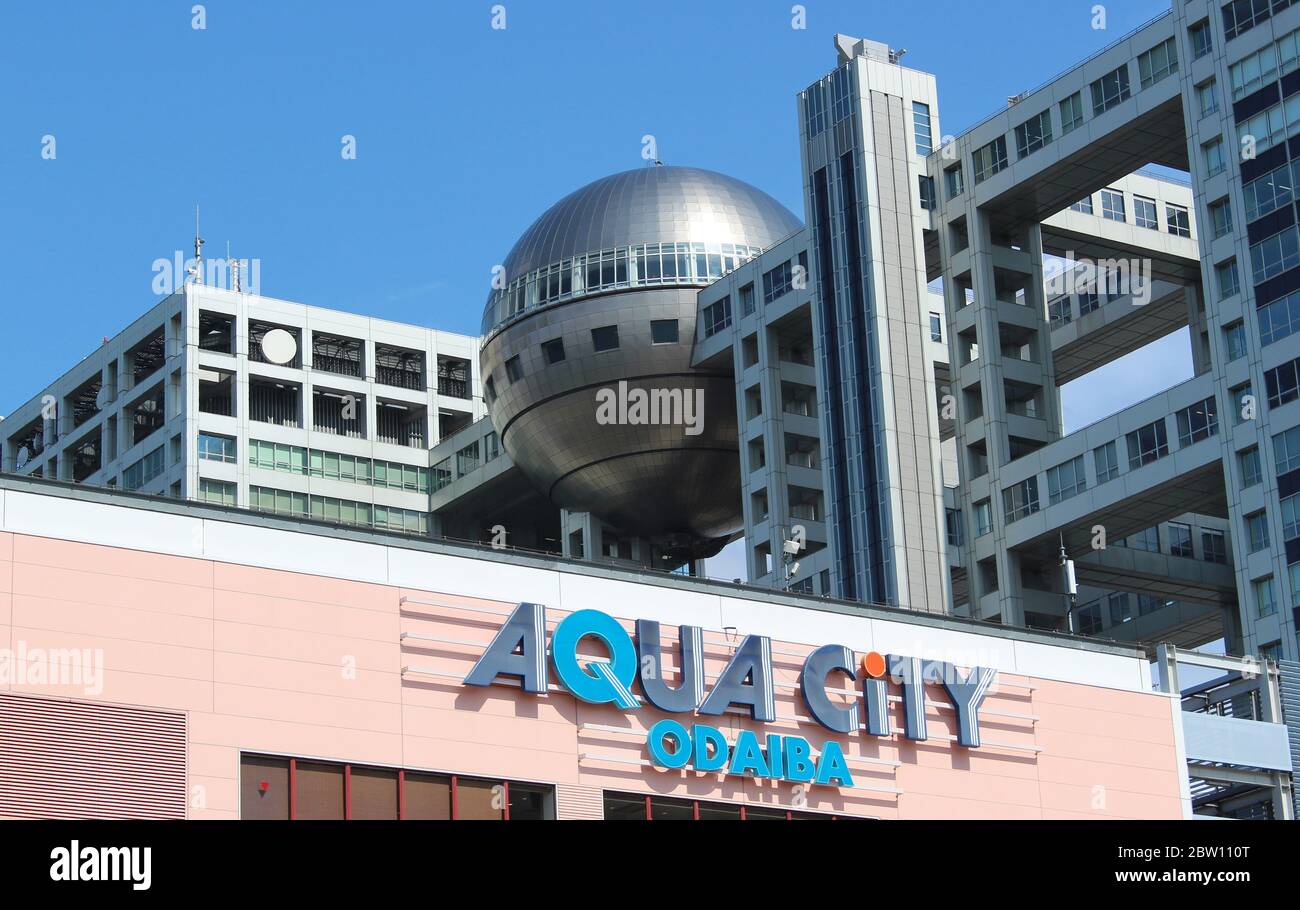 Aqua City Mall with Odaiba Fuji Building behind on a sunny day. Tokyo, Japan Stock Photo