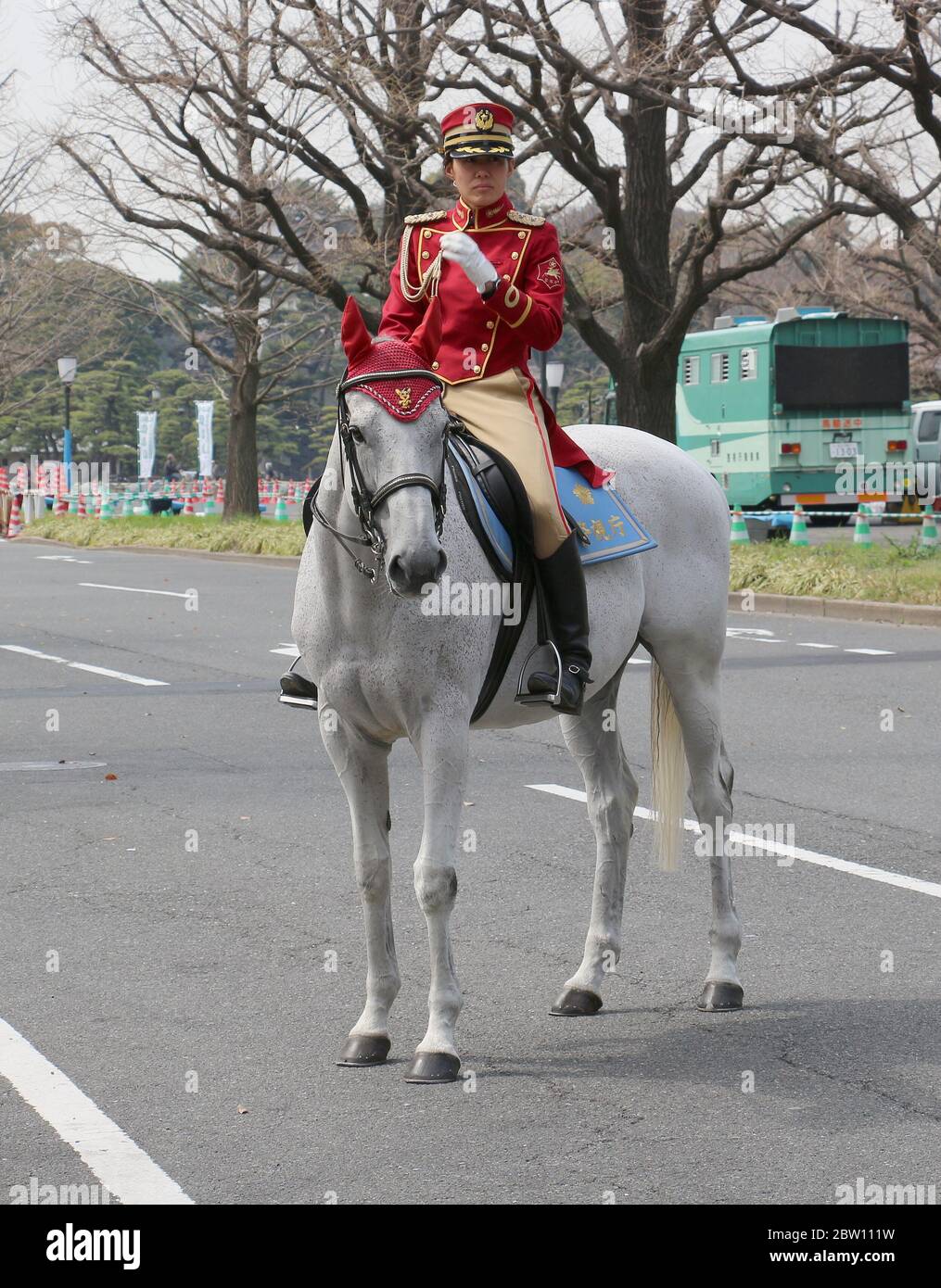 Lady police officer on horseback on the streets outside the Imperial Palace. Tokyo, Japan Stock Photo