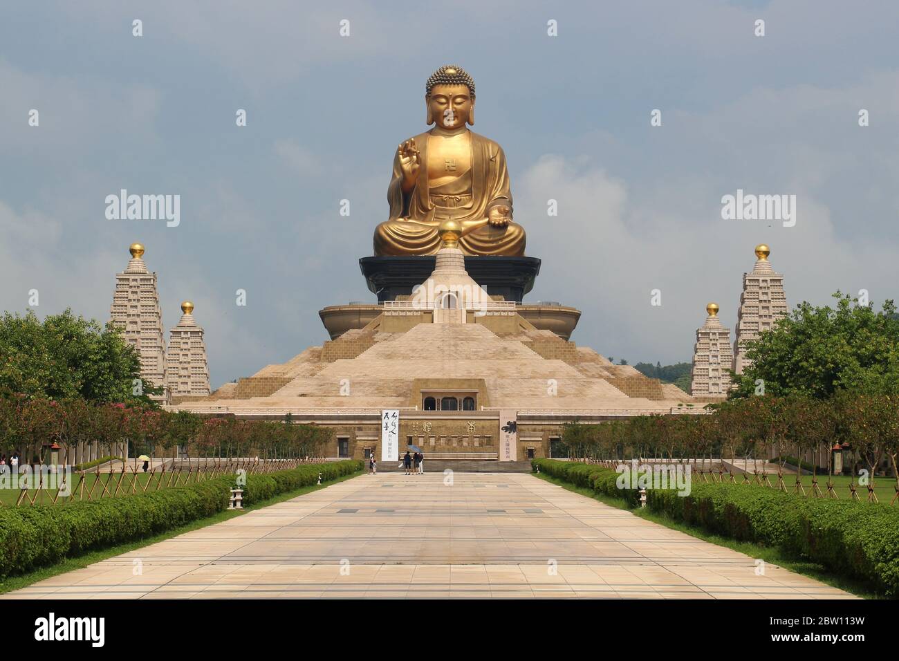 The Fo Guang Shan Monastery, a giant golden praying Buddha on top of a stone pyramid museum. Kaohsiung, Taiwan Stock Photo