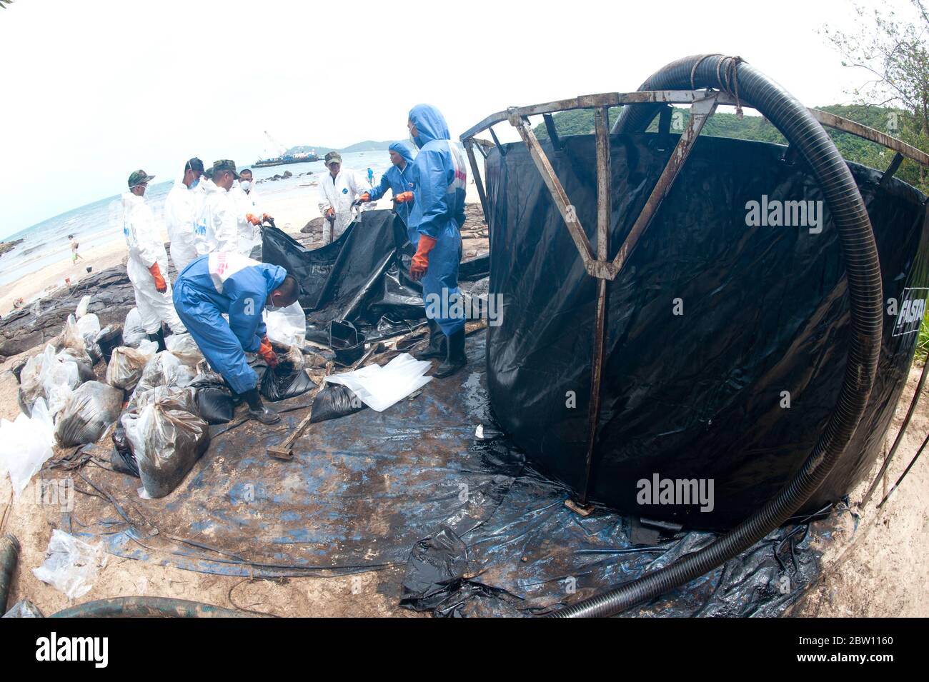 A large plastic tank for storing crude oil that flows into the sea and