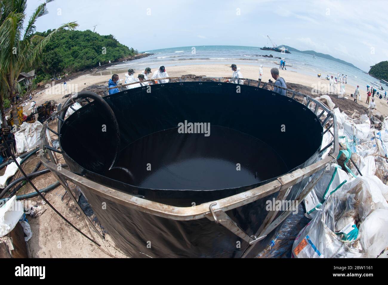 A large plastic tank for storing crude oil that flows into the sea and