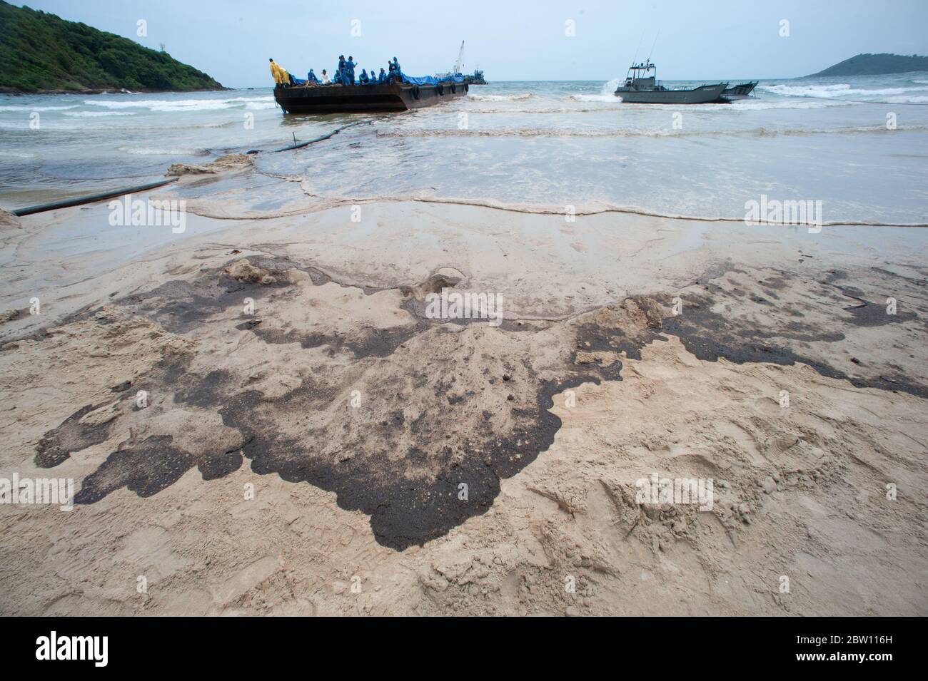 Black oil marks on the beach Which is harmful to the environment Stock