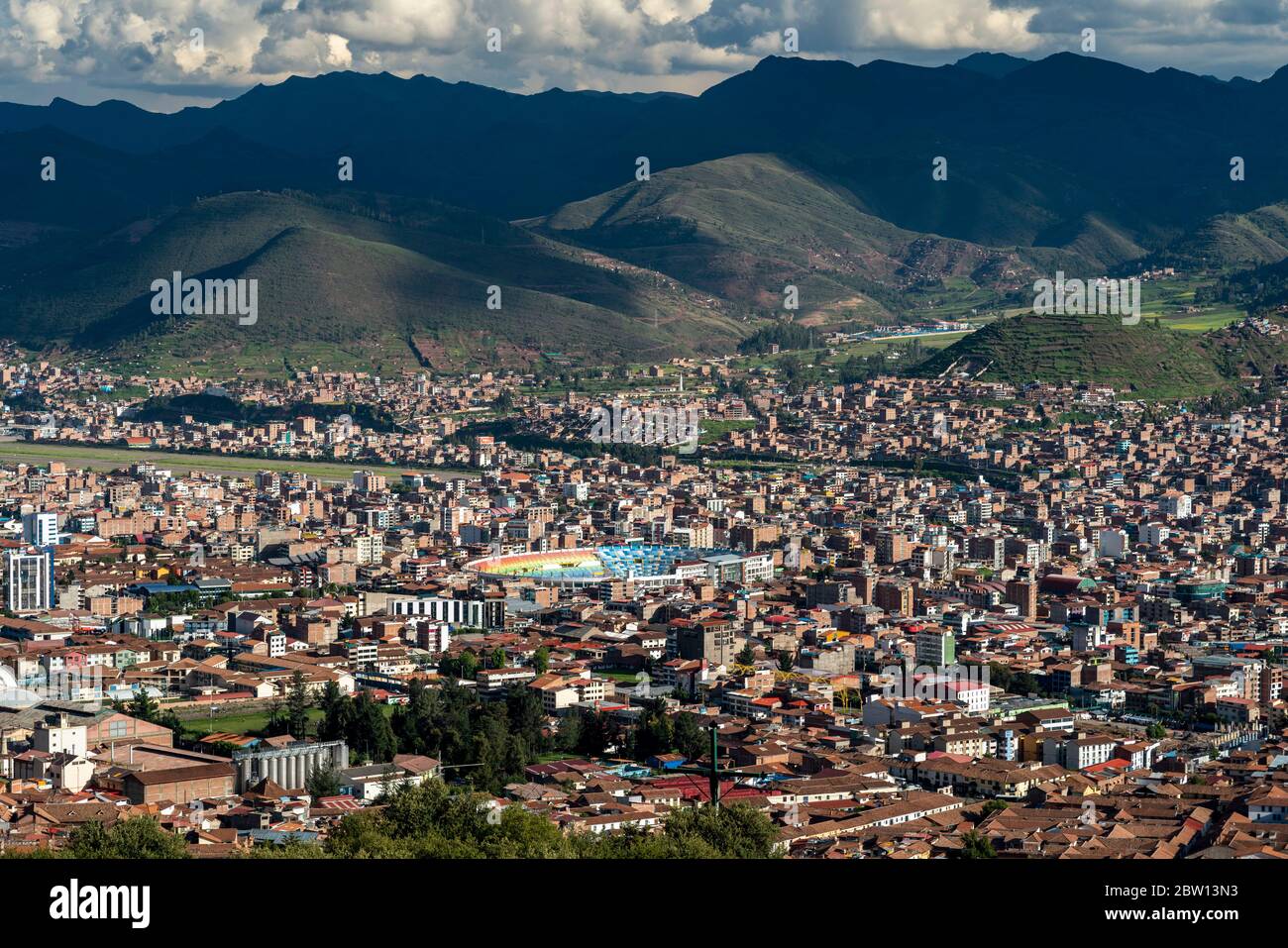 HIgh angle view of Cusco Peru with soccer stadium and airport runway. Stock Photo
